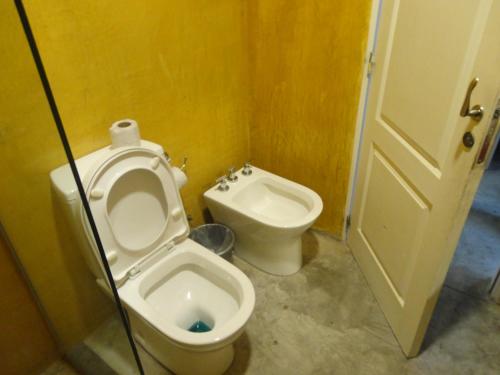 a bathroom with a toilet and a bidet at Enjoy 360 in Villa Carlos Paz