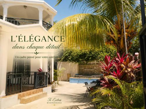 a house with a sign that reads excellence loans change dividend at Hotel El Elyon Ti Extra in Terrier Rouge