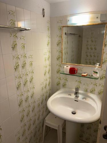 a bathroom with a sink and a mirror at Villa Marco Polo in Agia Marina