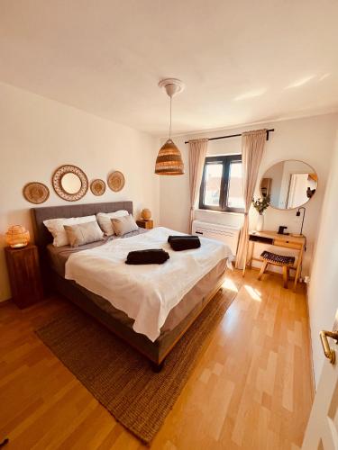 a bedroom with a large bed in a room at Casa Milano Krk in Njivice