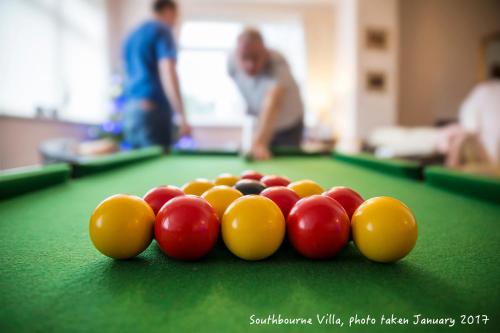 a group of cue balls on a pool table at The Southbourne Villa in Torquay