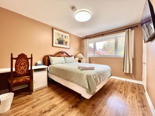 a bedroom with a bed and a window at Renovated Rooms 10-min to Finch Subway Near Yonge St in Toronto