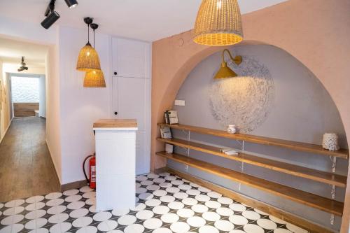 a kitchen with two pendant lights and a counter at Casa Fiore in Seferihisar