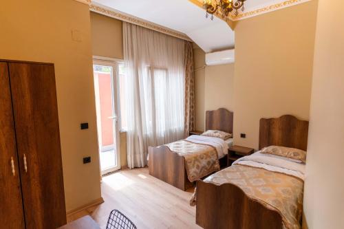 a room with two beds and a window at The Old Ottoman Castle in Istanbul