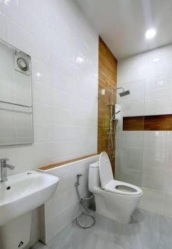 a bathroom with a toilet and a sink at 50 m by BTS Taladplu in Thonhuri