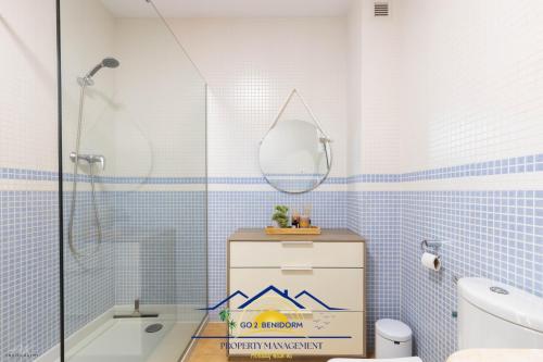a bathroom with a tub and a sink and a mirror at Altea Hillside Harmony in Altea