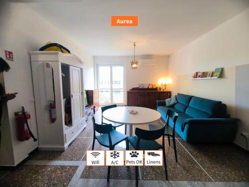 a living room with a couch and a table at Principe - By Turent in Pietra Ligure