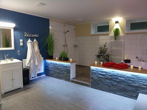 a bathroom with a sink and two sinks and a counter at Wellness apartmány Puštík se soukromou vířivkou a saunou in Pěnčín