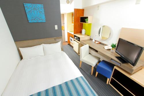 Un pat sau paturi într-o cameră la HOTEL MYSTAYS Ueno Inaricho