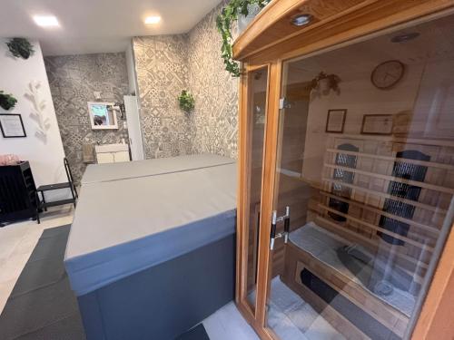 a kitchen with a counter and a window at Blanka Villa Wellness Home in Bakonyszentlászló