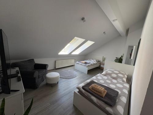 a living room with a bed and a couch at Ferienwohnung am Flughafen in Braunschweig