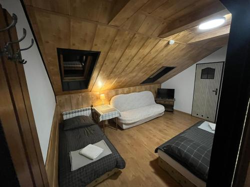 an overhead view of a room with a bed and a couch at Noclegi U Waldiego in Starachowice