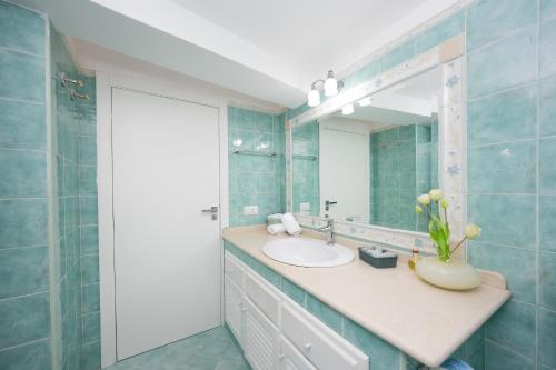 a bathroom with a sink and a mirror at Birago22Capri in Capri