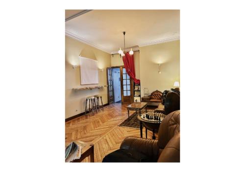 a living room with a couch and a table at Casa Quixote, Centro Catedral in Braga