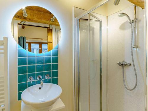 a bathroom with a sink and a shower at 2 Bed in Usk- oc-87285 in Llandenny