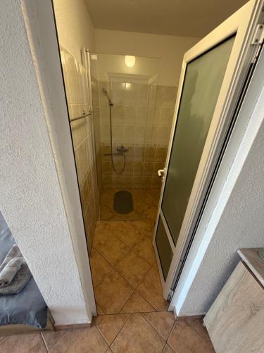 a bathroom with a shower with a toilet in it at Serenity Hill-Bulharsko U Nás in Sveti Vlas