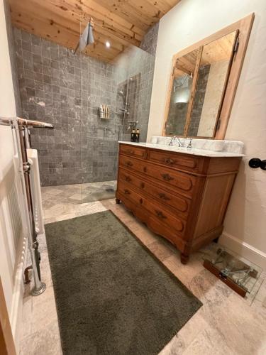 a bathroom with a sink and a shower at ChaletFeeling im Salzkammergut in Strobl