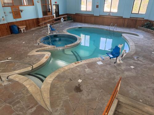 an overhead view of a swimming pool in a building at Rodeway Inn Lake Placid South in Lake Placid