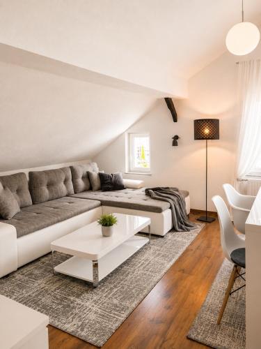 a living room with a couch and a table at Haus OS in Bischofshofen