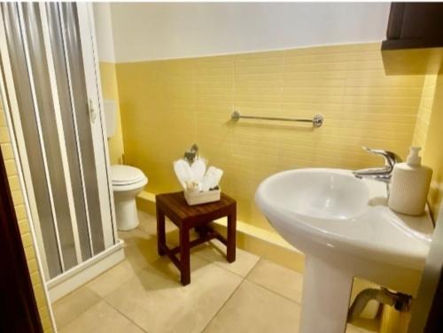 a bathroom with a sink and a toilet at Il Moro di Ossuna in Trapani