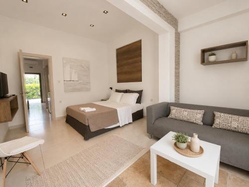 a living room with a bed and a couch at Aelia Living in Stavros