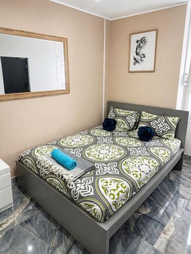 a bedroom with a bed with a television on it at Canelle appart tout équipé et lumineux in Dzaoudzi