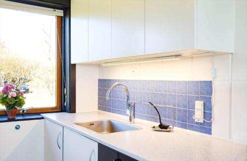 a kitchen with a sink and a window at 14250-Grevinge-Hybenvaenget-9 in Grevinge