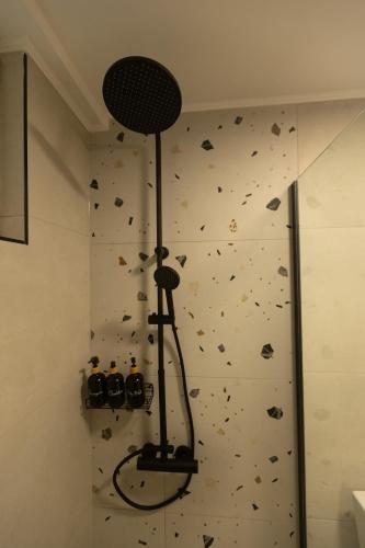 a room with a rock wall with a rock climbing wall at Bitola Stay in Bitola