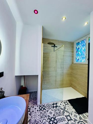 a bathroom with a shower and a sink at Quartier Général des Gamers Arcade Terrasse in Saint-Omer