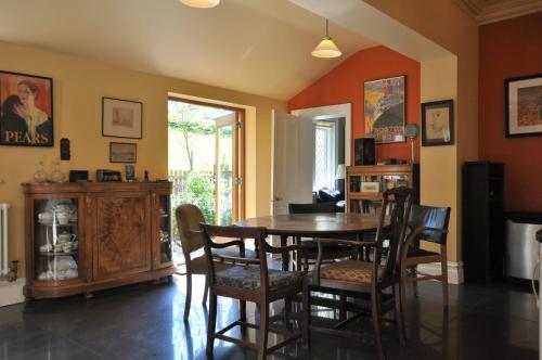 a dining room with a table and chairs at Hollins Lodge in Grosmont