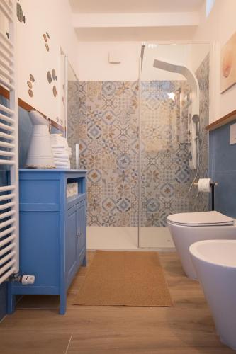 a bathroom with a blue sink and a shower at In ta Villa da u Perinetti in Bastia