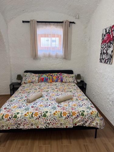 a bed with two pillows on it in a bedroom at La Casa de Nido-Cozy Studio in Veszprémfajsz