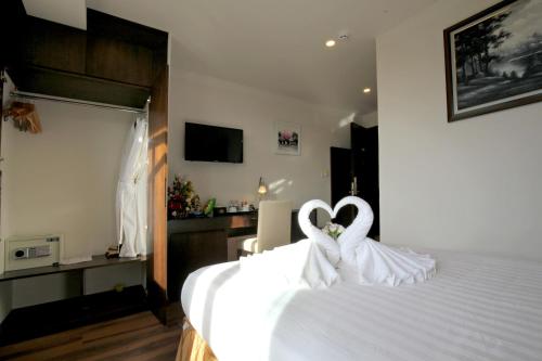Ένα ή περισσότερα κρεβάτια σε δωμάτιο στο Kings Hotel Dalat