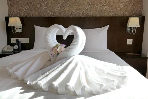Ένα ή περισσότερα κρεβάτια σε δωμάτιο στο Kings Hotel Dalat