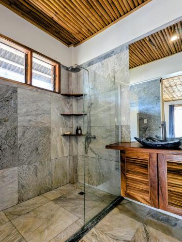 a bathroom with a shower and a sink at Safira Resort in Santa Fe