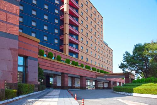a rendering of a building with a driveway at ホテルKOYO in Hashima