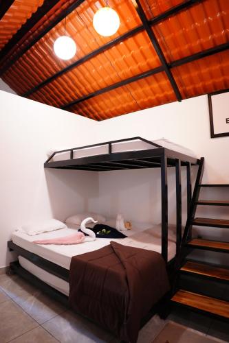 a bunk bed in a room with a staircase at Eden Park Resorts in Vuyyūru