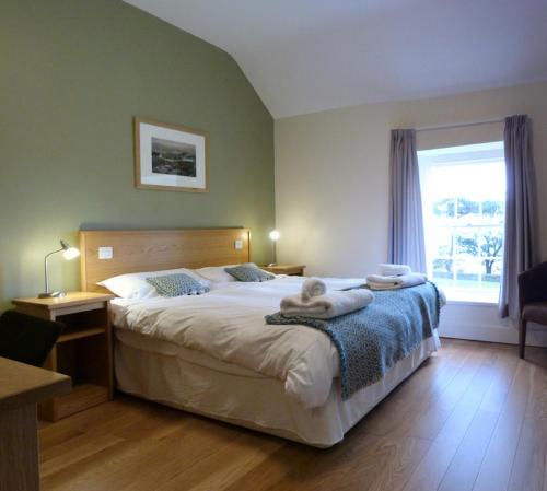 Кровать или кровати в номере Nant - Llandaf