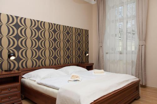 Postel nebo postele na pokoji v ubytování Hotel Richmond Teplice