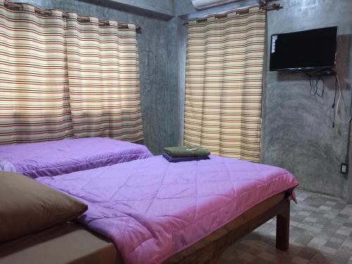 Chiangmai HomeTeLにあるベッド
