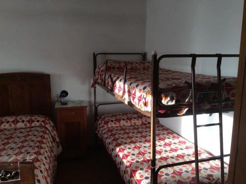 Ένα ή περισσότερα κρεβάτια σε δωμάτιο στο Albergo Cervo