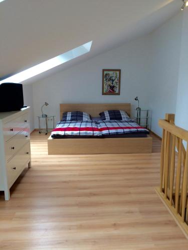 a bedroom with a bed and a skylight at Individuell Wohnen Loft-Charakter im Innenhof in Neuss