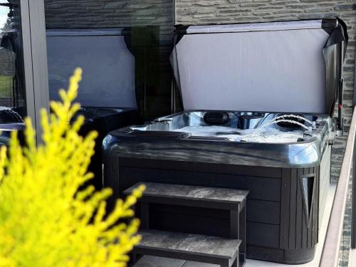 a sink sitting inside of a building at Lodge Osciade in Sibret