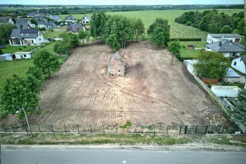 an aerial view of a field with a bulldozer at Gortatowo Natura 2000 in Gortatowo