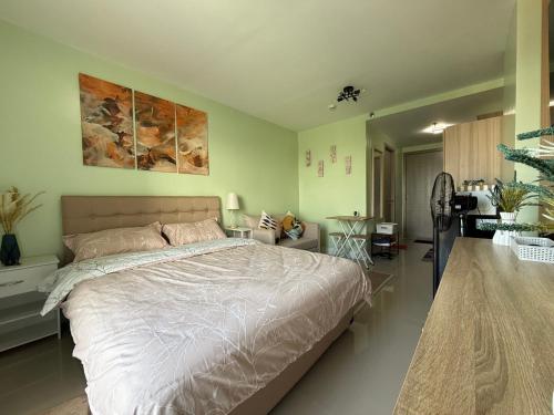 a bedroom with a large bed in a room at D Avenue Studio in Iloilo City