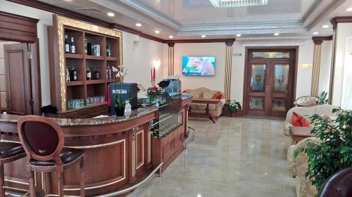 a bar in a hotel room with a lobby at Hotel Forum in Pazardzhik