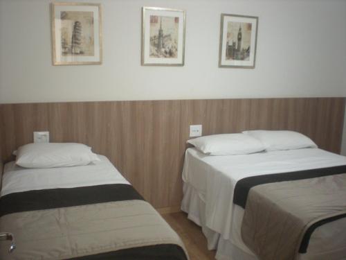 Ένα ή περισσότερα κρεβάτια σε δωμάτιο στο Hotel Villaggio Nobre