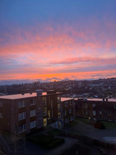a view of a sunset from a building at Spacious apartment with amazing views in Sandnes