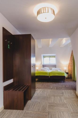Кровать или кровати в номере Hotel Artus - Old Town