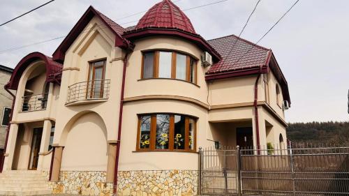 a house with a tower on top of it at Готель Соняшник in Solotvyno